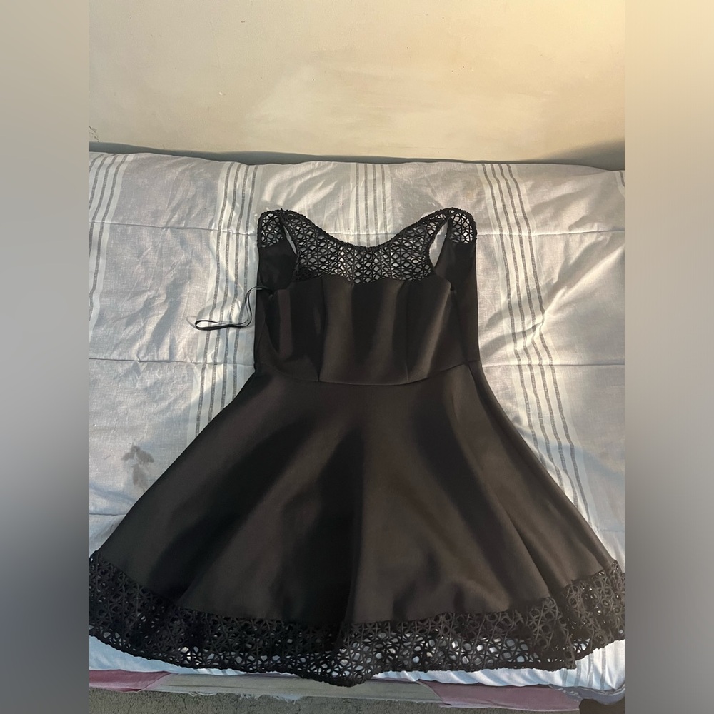 CUTEEE! short black dress little design on the bottom and the sleevesz